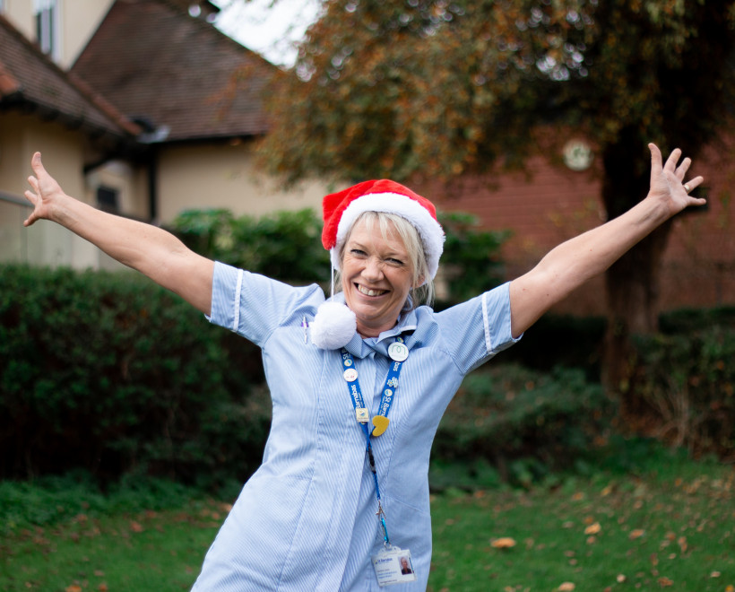 A St Barnabas nurse wearing a Christmas Hat at our Barrowby Road Wellbeing Centre in Grantham