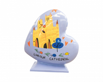 A Heart-shaped sculpture, painted with designs depicting the well known tourist areas of Lincoln, the Lincoln Cathedral and The Straight. This sculpture is part of the St Barnabas HeART Trail.