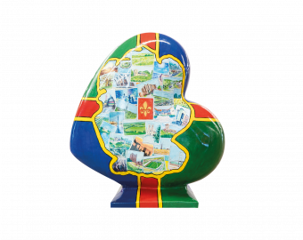 A Heart-shaped sculpture, painted with the Lincolnshire flag, featuring a map of Lincolnshire in the middle, with numerous postcard like illustrations depicting areas across Lincolnshire. This sculpture is part of the St Barnabas HeART Trail.