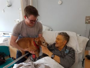 Trevor and his dog in the Inpatient Unit