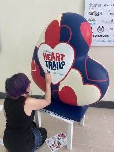 Mel Langton, Art ambassador for the HeART Trail, painting the heart