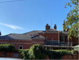 The top of the Inpatient Unit in Lincoln against blue sky