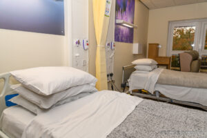 Two beds with pillows and bedding in the Inpatient Unit ward in Lincoln