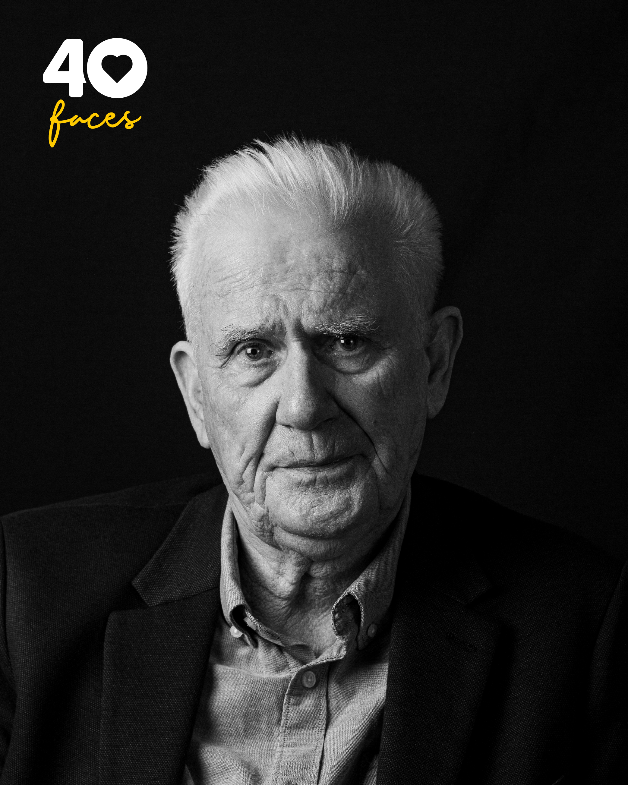 A Man, Bob Neilans, who is Honouree Lifetime President of St Barnabas Hospice, photographed in black and white, against a black backdrop