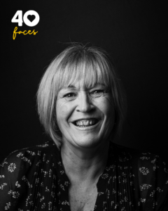 A lady, Mandy Fryer, who is a member of staff at the St Barnabas Hospice Inpatient Unit in Lincoln, photographed in black and white, against a black backdrop