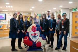 Group of students and staff at William Farr, along with Caroline Swindin of St Barnabas and artist Mel Langton
