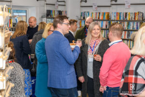 Group of people gathered in The Warehouse charity shop in Lincoln.