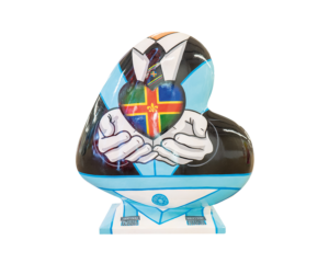 A Heart-shaped sculpture, painted with a design depicting a suited man, holding up the Lincolnshire Freemason's logo. This sculpture is part of the St Barnabas HeART Trail.