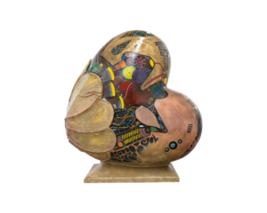 A Heart-shaped sculpture, painted with a design that resembles the inner workings of technology, featuring wires, cogs and circuitry. This sculpture is part of the St Barnabas HeART Trail.