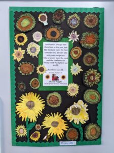 Sunflowers drawn by children on canvas with Bible quote, photo and information about Sharon Popple