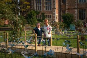 Warwick and Samantha Davis smiling to the camera on a bridge
