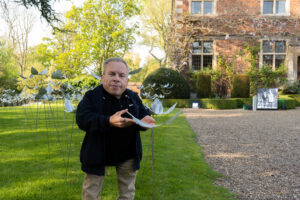 Warwick Davis at St Barnabas Feathers From Above Display