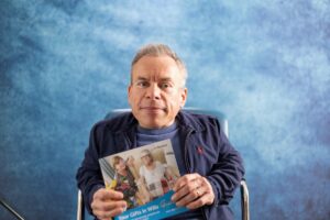 Warwick Davis with 'Your Gifts in Wills Guide