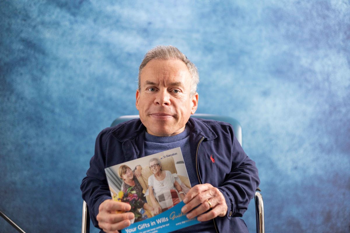 Warwick Davis with 'Your Gifts in Wills Guide