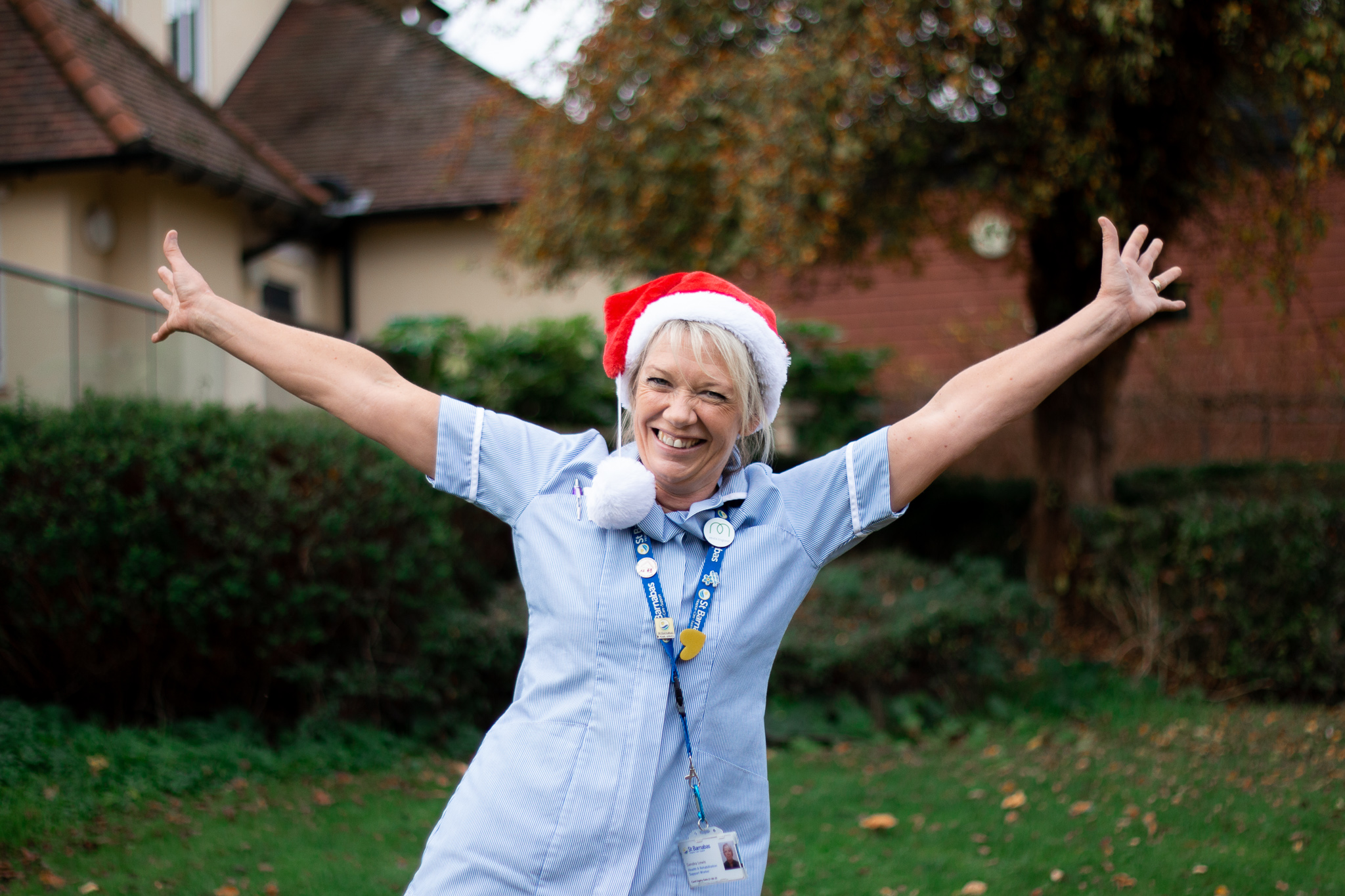Nurse in Christmas Hat Celebrating Treecycle Appeal